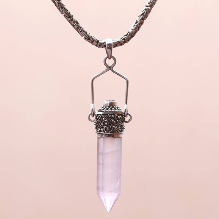 A single crystal quartz prism brings a touch of glamour to this necklace by Balinese jewelry artisan Made Sugi. A clear quartz crystal sits in an ornate sterling silver setting featuring nature-inspired vine motifs. An elegant purple amethyst graces the top of the pendant. Silver Quartz Round Pendant Jewelry, Spiritual Quartz Jewelry With Natural Stones, Spiritual Quartz Pendant Jewelry, Silver Bohemian Crystal Necklaces With Gemstone, Silver Bohemian Crystal Necklace With Gemstone, Bohemian Silver Crystal Necklace With Gemstone, Healing Quartz Wire Wrapped Jewelry, Silver Sterling Silver Crystal Necklaces With Natural Stones, Bohemian Sterling Silver Crystal Necklace