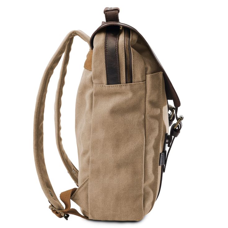 * Durable canvas and leather construction
 * Plenty of compartments
 * Adjustable-length straps Arctic Blue, Pink Canvas, Leather Accents, Cool Backpacks, Blue Canvas, Designer Backpacks, Men's Backpack, Vintage Looks, Leather Backpack