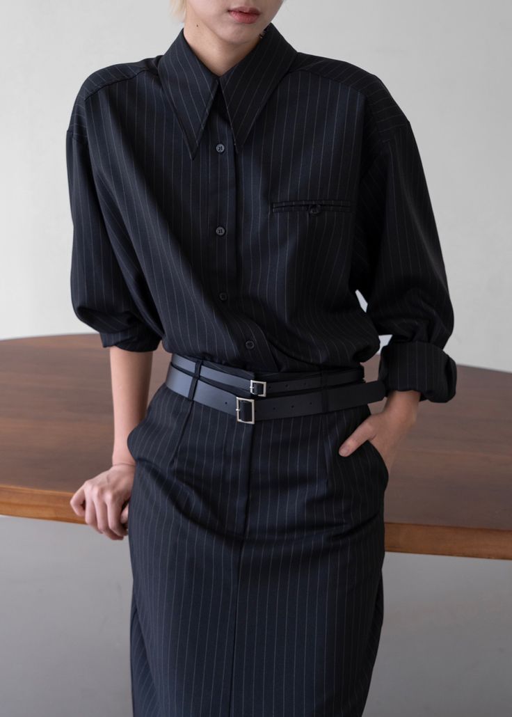 Color: Black Pinstripe Midweight woven fabric Regular fit Pointed collar Drop shoulders Front breast welt pocket with button closure Button cuffs Front button closure Unlined 75% Polyester 20% Rayon 5% Wool  Dry Clean Imported Vertical Stripes Button-up Business Casual Shirt, Vertical Stripes Button-up Shirt For Business Casual, Business Casual Button-up Shirt With Vertical Stripes, Business Casual Vertical Stripes Button-up Shirt, Chic Office Shirt With Vertical Stripes, Chic Vertical Stripes Office Shirt, Pinstripe Collared Shirt For Work, Chic Vertical Stripes Shirt For Workwear, Business Pinstripe Shirt With Button Closure