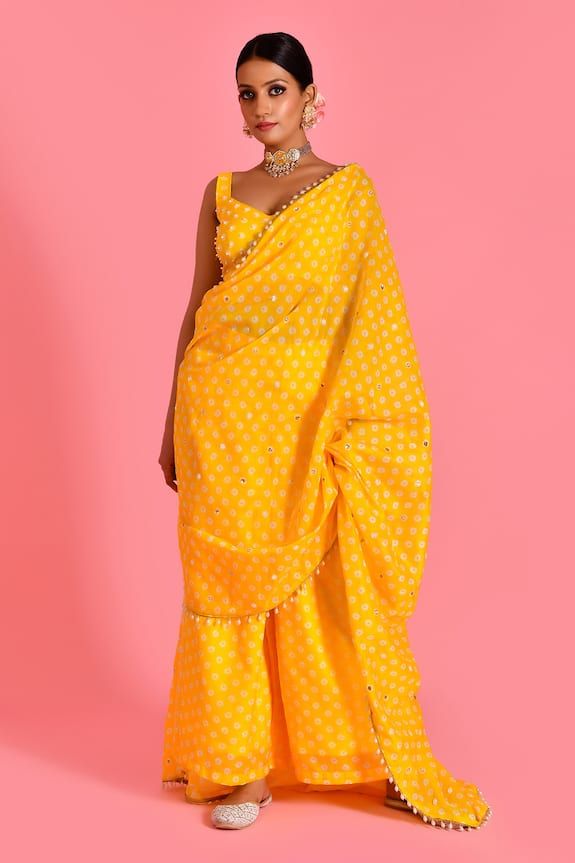 Yellow palazzo with bandhani pattern and pearl tassel embellished border on attached pallu. Paired with embellished padded blouse. - Aza Fashions Palazzo Saree, Bandhani Pattern, V Neck Pattern, Saree Gowns, Dhoti Saree, Cotton Sarees Handloom, Ruffle Saree, Padded Blouse, Drape Saree