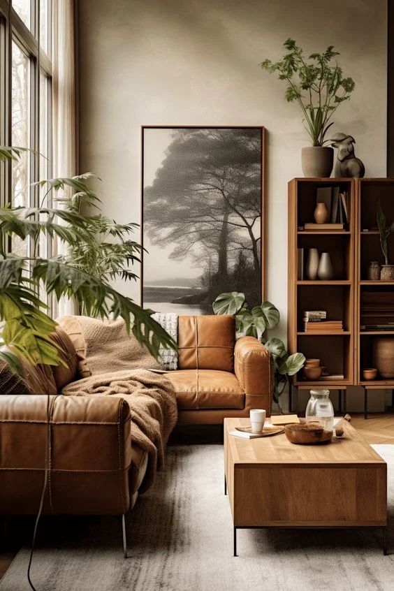 a living room filled with furniture and plants