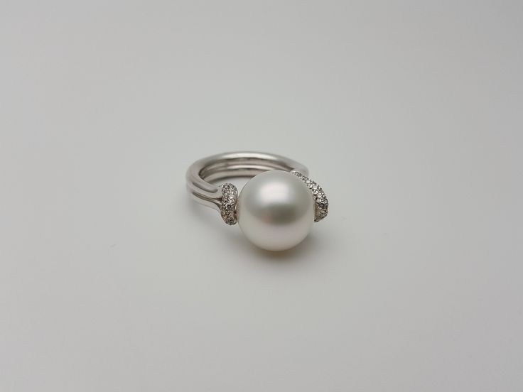 This elegant set of Australian South sea cultured pearls and diamonds ring and earrings is a must-have in a woman's wardrobe. A great opportunity for a perfect gift for yourself or for the person you love! 0.30 carats of diamonds in the ring 13.7mm pearl 1.03 carats of diamonds in the earrings. 12mm pearls Handmade by a famous designer * White Australian South sea pearls * Beautifull luster, x2 of 12mm, x1 of 13.7mm pearls * 18K White gold * 1.33 total carats of diamond in the set * H color VS c Luxury Pearl Ring With Single Diamond Fine Jewelry, Luxury Pearl White Pearl Ring With Diamond Accents, Luxury Formal Pearl White Pearl Ring, Luxury Pearl Ring In Diamond White, South Sea Pearl Ring, Japanese Pearls, Beautiful Pearl Necklace, Famous Designer, Pearl And Diamond Ring