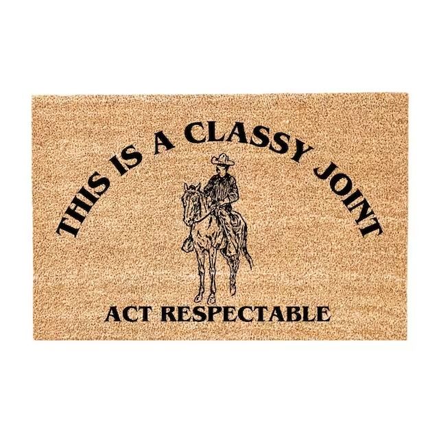 a door mat that says, this is a classy jon act respectable