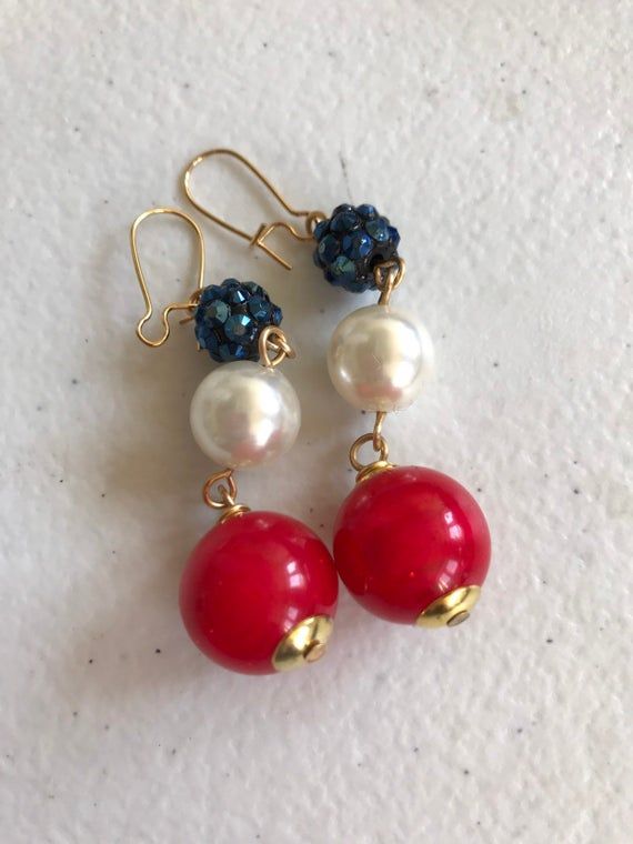 Triple bead drop earrings in red white and blue.  Great for the 4th and beyond. Great gift. Thanks for looking!! Red Jewelry With Colorful Beads For 4th Of July, Red Pearl Drop Earrings For Festive Occasions, Festive Red Pearl Drop Earrings, Patriotic Blue Earrings For Party, Handmade Red Beaded Earrings For 4th Of July, Red Beaded Jewelry For 4th Of July, Red Pearl Earrings For Party, Red Jewelry For 4th Of July Gift, Red Dangle Pearl Earrings For Festive Occasions