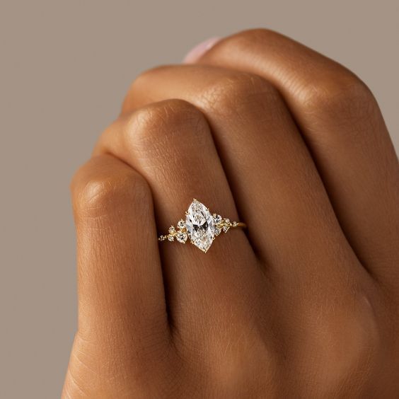 a woman's hand with a diamond ring on it