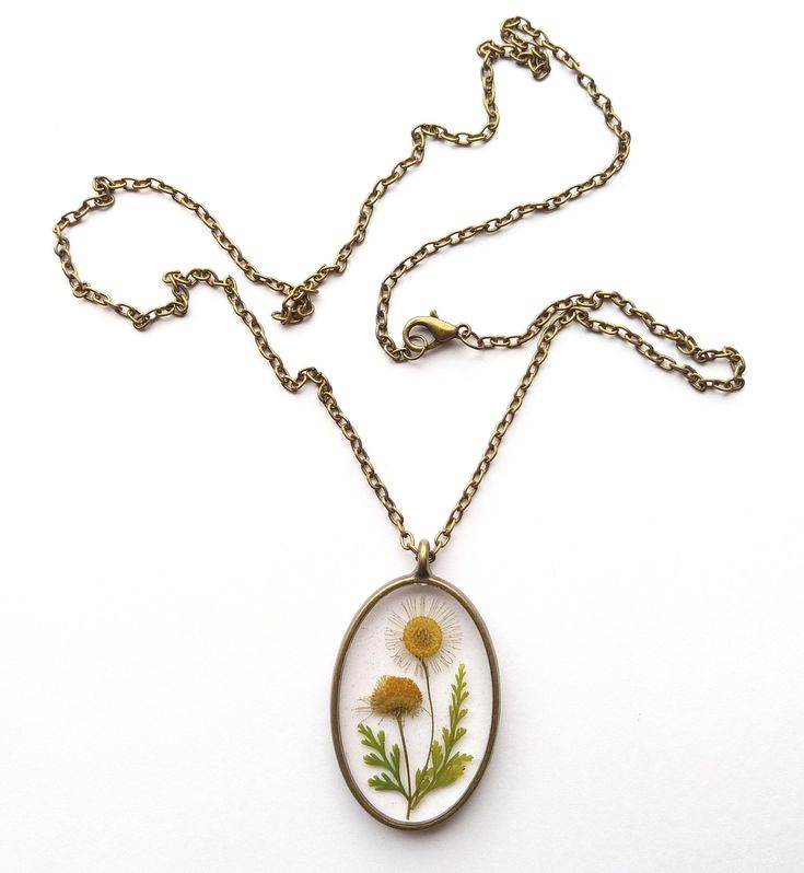 An unique handmade real pressed flower resin necklace. Do you love nature but too busy to get a real touch of it? Then this is the perfect piece of real flower necklace to reconnect you to mother nature! This necklace is created with pressed real wild daisy twig and lace fern leaves! Beautiful floral gifts of mother nature were carefully handcrafted to create unique design and embedded into high quality resin to provide everlasting value! Now set yourself free from the boredom of artificial urba Real Flower Jewellery, Flower Jewelry Designs, Pressed Flower Resin, Set Yourself Free, Wild Daisy, Real Flower Necklace, Pressed Flower Necklace, Fern Leaves, Real Flower Jewelry