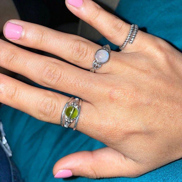 Please note, this is a WIRE and BEAD ring. It is made with sterling silver wire, and a genuine Moldavite bead. The higher price for this ring is due to it being made with genuine Czech Moldavite, which I have invested in a very limited supply of. I am almost out of stock, so the price will reflect that. I hope to find more in the future, and will adjust the price accordingly to my supply :) This ring is uniquely hand-crafted with 22 gauge sterling silver round wire, 4x5mm sterling silver Bali be Silver Stackable Rings With Gemstone, Silver Stackable Rings With Round Gemstones, Adjustable Silver Stackable Jewelry, Silver Moonstone Stackable Rings With Birthstone, Handmade Peridot Jewelry For May Birthstone, Peridot Birthstone Ring Jewelry, Stackable Peridot Jewelry Gift, Dainty Hand-wrapped Silver Rings, Stackable Peridot Jewelry As Gift