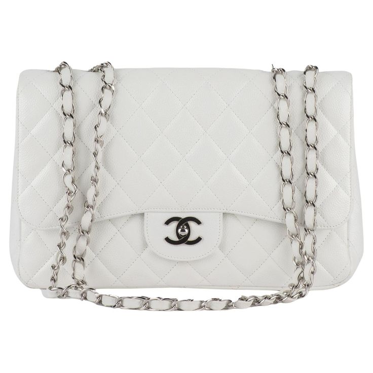 Chanel jumbo single Flap Bag features white diamond quilted leather. A leather-threaded polished silver chain-link shoulder strap, a rear patch pocket, and a matching silver classic CC turn-lock. This opens the bag to reveal an inner zipper pocket. Collection 12, copy of original receipt. Shoulder drop 13". Excellent exterior, minor wear in the interior. Hologram and dust cover. Classic White Bag With Cc Turnlock Closure, Classic White Double Flap Bag, Luxury White Shoulder Bag With Cc Turnlock Closure, White Double Flap Formal Bags, Elegant White Double Flap Shoulder Bag, Elegant White Shoulder Bag With Cc Turnlock Closure, White Leather Shoulder Bag With Cc Turnlock Closure, White Leather Double Flap Shoulder Bag, Chic White Double Flap Shoulder Bag