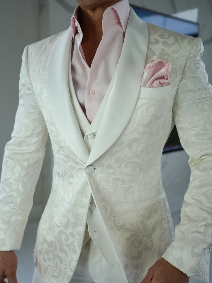 Happy Sunday 🤩🥂 Check out the amazing details of our latest White Paisley Dinner Jacket Look! Paired it with Pink today 💖🤍 Tag someone who needs this in their life 🙏🏻 #sebastiancruzcouture #whitepaisley #jacquardsuit #smokingjacket #bespoke #groom #groomstyle #mensclothing #mensfashion #dinnerjacket White Wedding Blazer With Double Button Closure, Designer White Blazer With Lapel Collar, Luxury White Blazer With Buttons, Elegant Beige Suit With Double Button Closure, Wedding Outerwear With Lapel Collar And Single Button, Semi-formal Cream Outerwear With Double Button Closure, Fitted White Outerwear With Double Button Closure, White Fitted Outerwear With Double Button Closure, Elegant Suits With Button Closure And Lapel Collar