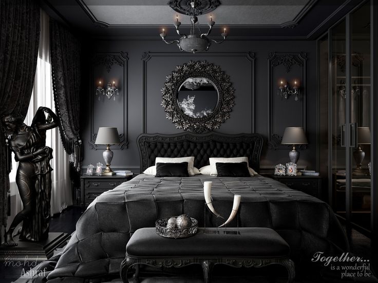 a black and white bedroom with antlers on the headboard, chandelier