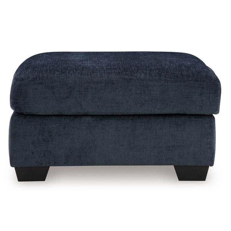 the footstool is made from dark blue fabric