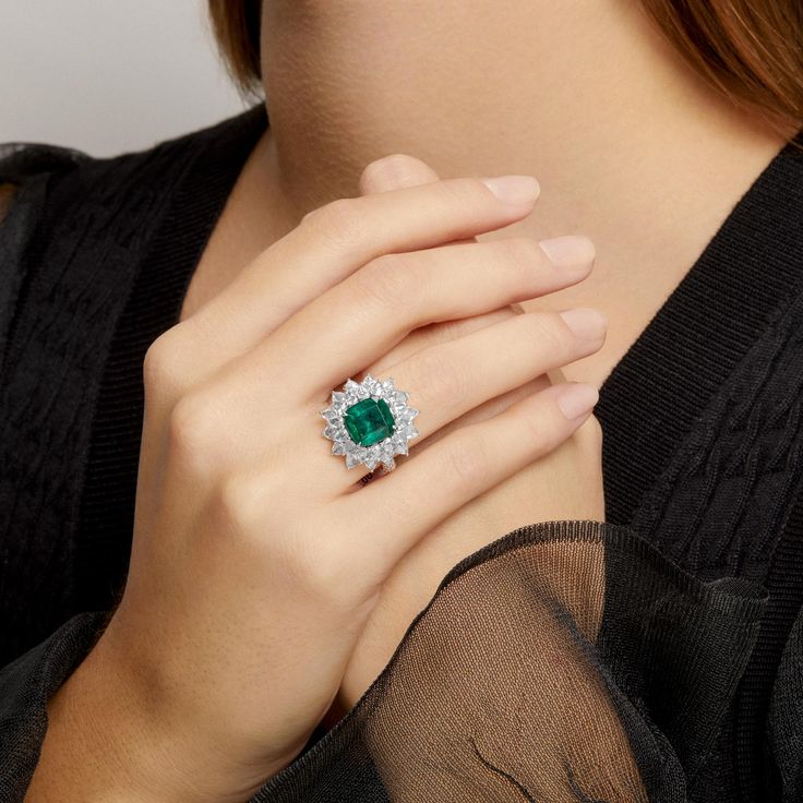 One of a Kind Ring. Outer diameter of ring measures 22mm x 22mm. Center stone Emerald measures 10mm x 10mm. Emerald sourced from Zambia. SKU ASRW4237 Carat Weight 4.72ct Emerald || 4.27ct Diamond Metal Type 18KT White Gold Primary Stone Emerald Weight 6.57g Color Grade H Clarity VS Luxury Gia Certified Diamond Gemstones, Luxury Platinum Cluster Emerald Ring, Luxury Gia Certified Gemstones, Luxury White Gold Gia Certified Gemstones, Luxury Gia Certified White Gold Gemstones, Gia Certified Luxury Cluster Rings, Luxury Gia Certified Cluster Rings, Luxury Cluster Diamond Ring With Gemstone, Luxury Emerald Cluster Ring With Halo Setting