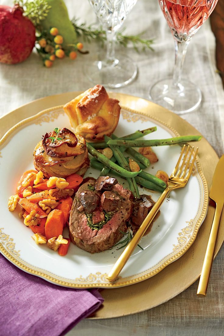 a white plate topped with meat and veggies