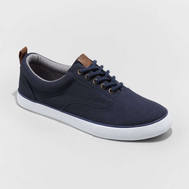 From casual office days to running errands to hanging out with friends, take on any occasion in cool style with these Brady Apparel Sneakers from Goodfellow and Co?. These medium-width shoes features a textured upper with crisp white outsoles to add texture and on-trend flair to any outfit you pair them with. Plus, the lace-up detailing gives you a comfy fit as you move through your busy day. Keep it casual with jeans and a henley, or dress it up with chino shorts and a button-down for easy warm Fall Season Low-top Canvas Shoes, Casual Navy Sneakers With Branded Insole, Casual Navy Sneakers With Rubber Sole, Casual Sneakers With Round Toe For Everyday, Blue Casual Sneakers For Walking, Casual Blue Sneakers For Walking, Casual Round Toe Sneakers For Everyday, Navy Casual Sports Sneakers, Casual Navy Slip-on Sneakers