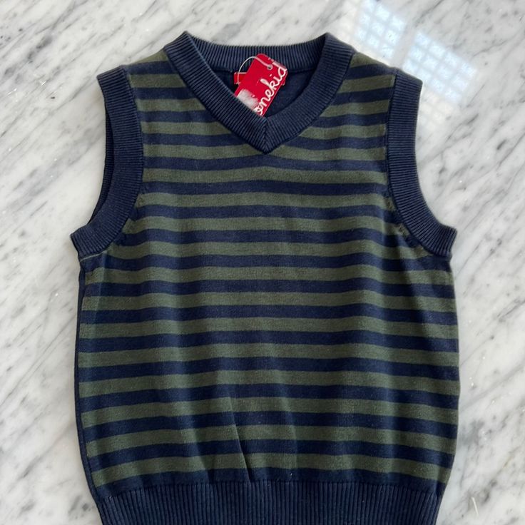 New One Kid Brand Vneck Sweater Vest. Its A Navy And Army Green Stripe. 100 % Cotton. All Of My Items Come From My Children's Boutique And Are Brand New, Directly From The Manufacturer. Please Feel Free To Ask Any Questions. Casual Striped Vest For Winter, Navy Cotton Sweater Vest For Winter, Navy Cotton Casual Sweater Vest, Classic Blue Cotton Sweater Vest, Casual Fall Sweater For Playwear, Casual Navy Cotton Sweater Vest, Cotton V-neck Top For School, Casual V-neck Tops For School, Classic Fall Tops For School