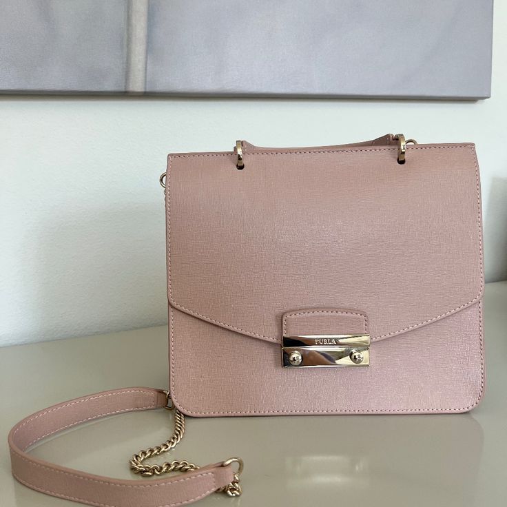 Beautiful Furla Crossbody Bag, Blush Pink, Unworn, Like New Condition With Duster Bag. Dimensions: Height - 8 Inches Width - 9.5 Inches Depth (Bottom) - 3.5 Inches Luxury Pink Box Bag For Daily Use, Pink Top Handle Box Bag With Dust Bag, Feminine Top Handle Shoulder Bag, Feminine Formal Shoulder Bag With Detachable Strap, Luxury Pink Flap Bag With Detachable Strap, Formal Pink Flap Bag With Detachable Handle, Elegant Pink Flap Bag For Formal Occasions, Luxury Pink Clutch Flap Bag, Elegant Pink Flap Bag With Detachable Strap