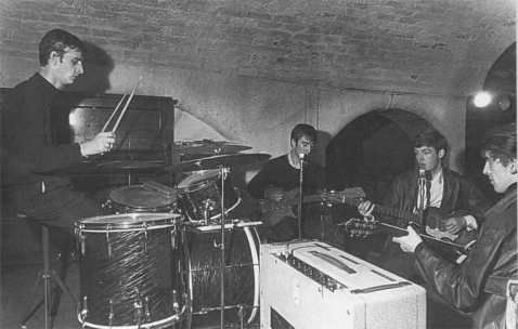 an old photo of some people playing instruments