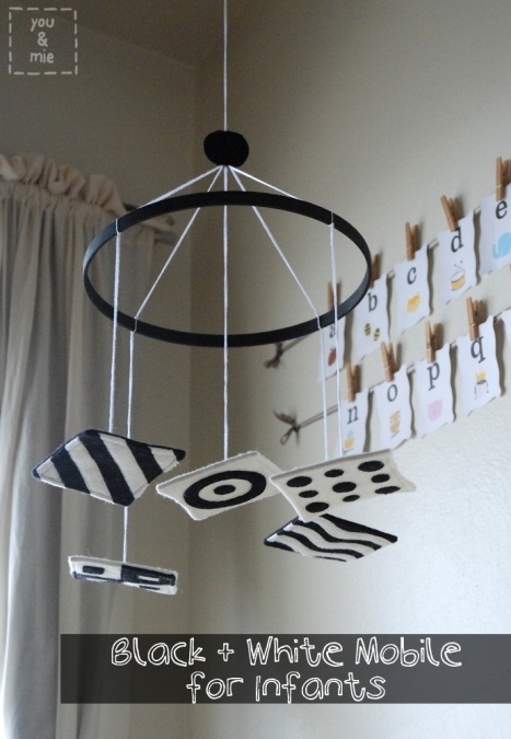 black and white mobile for infants hanging from the ceiling