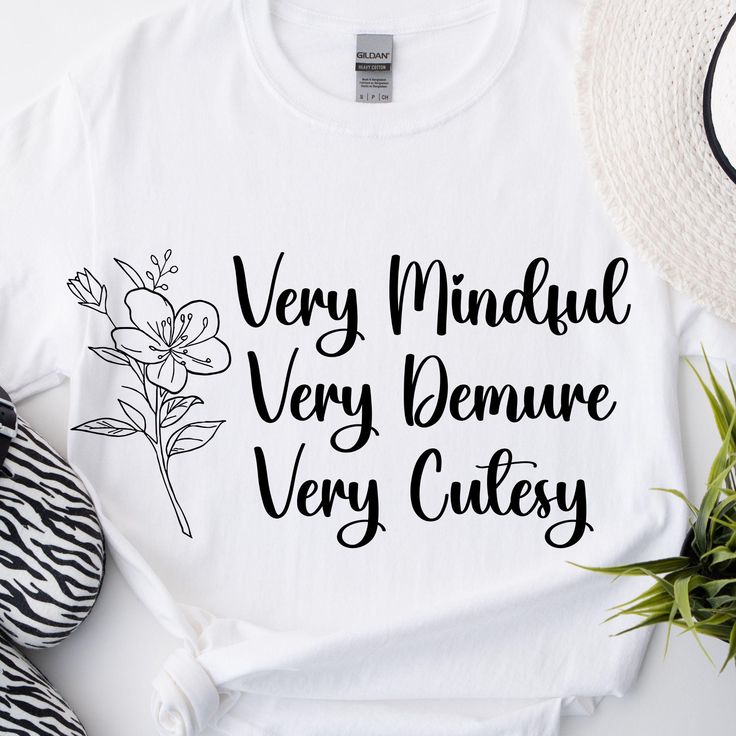 Show off your TikTok vibes with our "Very Mindful, Very Demure, Very Cutesy" T-Shirt! This trendy design captures the essence of your favorite TikTok personalities, blending mindfulness, elegance, and cuteness into one stylish statement. The unisex soft-style t-shirt puts a new spin on casual comfort. Made from very soft materials, this tee is 100% cotton for solid colors. Heather colors and sports grey include polyester. The shoulders have twill tape for improved durability. There are no side seams. The collar is made with ribbed knitting to prevent curling damage.  .: Made with 100% ring-spun cotton, a lightweight fabric (4.5 oz/yd² (153 g/m this unisex t-shirt feels like a bliss to wear all year round.  .: The classic fit with the crew neckline deliver a clean, versatile style that can White Quote Print T-shirt For Summer, Trendy Cotton T-shirt With Quote Print, Trendy Relaxed Fit Top With Quote Print, White Summer T-shirt With Quote Print, Summer Cotton T-shirt With Quote Print, White Cotton Tops With Quote Print, Cotton Tops With Quote Print For Spring, White Cotton Top With Quote Print, Spring Cotton Tops With Quote Print