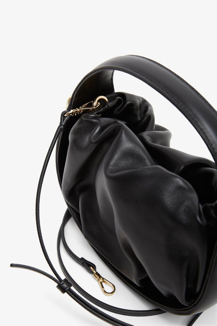 Black leather tote bag from Roger Vivier. The Viv' Choc hobo bag is made of nappa leather with a soft drape and can be carried by hand or crossbody with the removable shoulder strap. Measurements: L19 x H13.5 x W8 cmMade in Italy Black Hobo Bag, Black Leather Tote Bag, Black Leather Tote, Roger Vivier, Nappa Leather, Leather Tote Bag, Hobo Bag, Leather Tote, Shoulder Strap