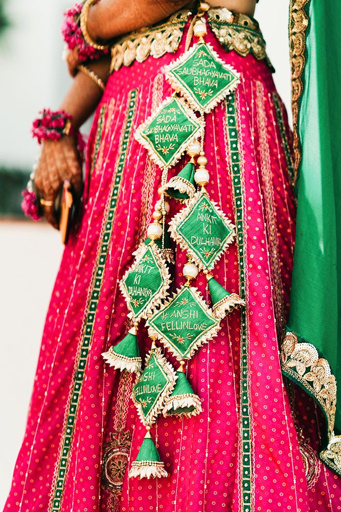 a woman in a pink and green outfit