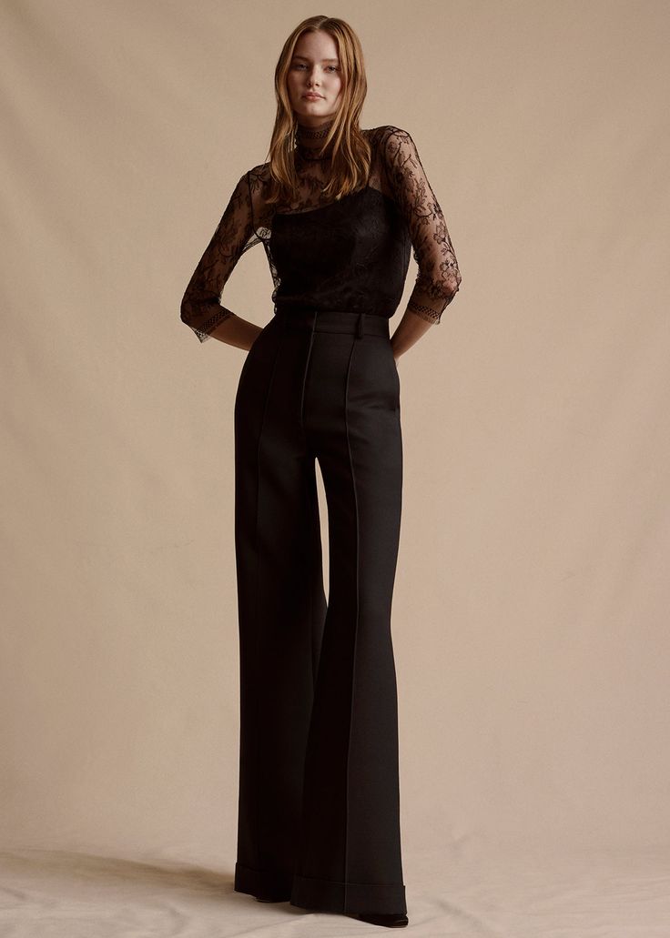 Image of a model in the black Deeda Pant in silk wool paired with the Chantilly Lace Turtleneck in black. Elegant Wide Leg Bottoms For Semi-formal Occasions, Timeless Fitted Wide-leg Dress Pants, Luxury Straight Leg Dress Pants For Evening, Silk Straight Pants For Evening, Chic High Waist Silk Wide Leg Pants, Luxury Straight Leg Pants For Evening, Chic High-waist Wide Leg Silk Pants, Fall Evening Pantsuit With Pressed Crease, Tailored Wide Leg Evening Pants