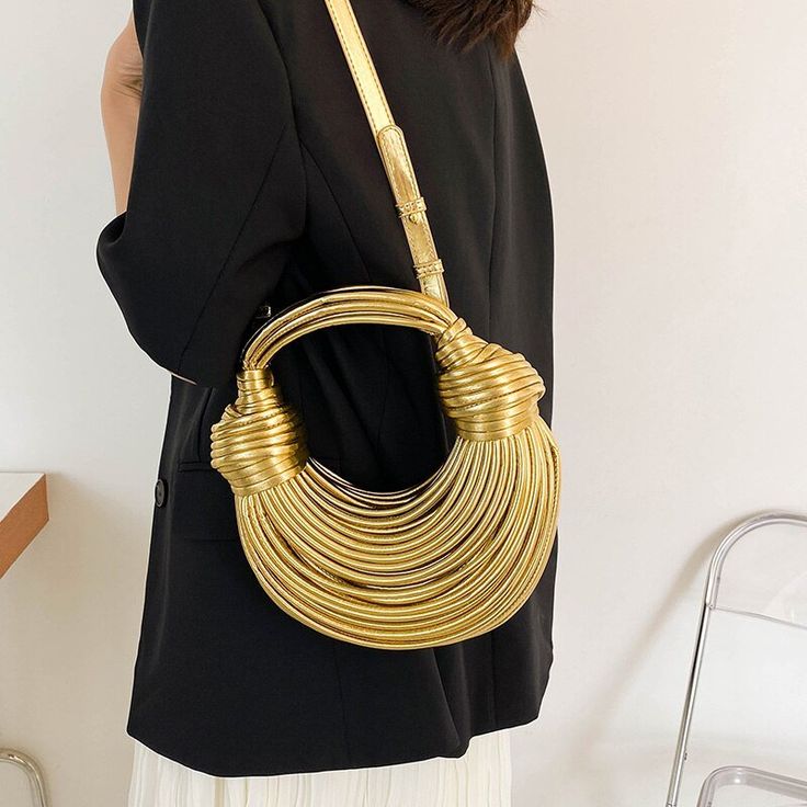 Make a bold fashion statement with our New Unique Noodles Shaped Designer Women's Crossbody Shoulder Bag. This luxurious and one-of-a-kind handbag is designed to showcase your unique style and add a touch of whimsy to your ensemble. Crafted with attention to detail, this bag features a distinctive noodles-shaped design that is sure to turn heads and spark conversations. The innovative and playful concept sets you apart from the crowd, making a statement wherever you go. With its crossbody should Chic Satchel With Adjustable Strap For Fashion, Gold Shoulder Bucket Bag With Top Carry Handle, Gold Bucket Shoulder Bag With Top Carry Handle, Gold Bucket Bag With Top Carry Handle, Fashion Crossbody Bag With Detachable Handle, Fashion Tote Shoulder Bag With Top Carry Handle, Modern Gold Handheld Shoulder Bag, Chic Fashion Satchel, Modern Shoulder Bag For Mobile Phone