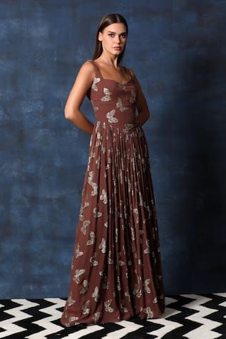 Brown sleeveless gathered flare gown in georgette base with all over butterfly embellishments and V waistline. - Aza Fashions Fitted Pre-draped Sleeveless Gown, Fitted Sleeveless Embellished Maxi Dress, Fitted Georgette Maxi Dress For Gala, Fitted Georgette Gala Dress, Fitted Georgette Dress For Gala, Festive Sleeveless Dress With Fitted Bodice, Sleeveless Pre-draped Summer Gown, Pre-draped Fitted Sleeveless Gown, Fitted Sleeveless Pre-draped Gown