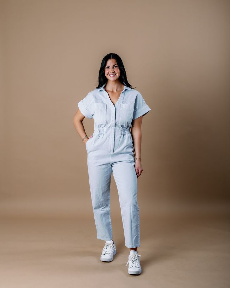 Introducing the Aspen Short Sleeve Jumpsuit, a contemporary take on classic utility wear. With its relaxed fit and short sleeves, it offers both comfort and functionality for everyday wear. The denim fabric adds a casual yet versatile touch, making it easy to dress up or down for any occasion. Whether you're running errands or meeting friends for brunch, the Aspen Short Sleeve Jumpsuit is the perfect choice for effortless style with a nod to heritage craftsmanship. Embrace the timeless appeal of Spring Utility Denim Jumpsuit With Short Sleeves, Spring Short Sleeve Utility Denim Jumpsuit, Casual Short Sleeve Relaxed Fit Jumpsuits And Rompers, Casual Jumpsuits And Rompers With Short Sleeve, Relaxed Fit, Casual Short Sleeve Jumpsuits And Rompers With Relaxed Fit, Utility Denim Jumpsuit With Short Sleeve And Relaxed Fit, Relaxed Fit Denim Jumpsuit With Short Sleeves And Pockets, Utility Style Denim Jumpsuit With Relaxed Fit, Denim Blue Short Sleeve Relaxed Fit Jumpsuits And Rompers