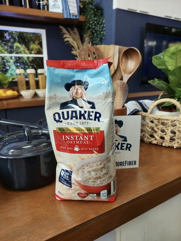 a bag of oatmeal sitting on top of a counter next to a pot