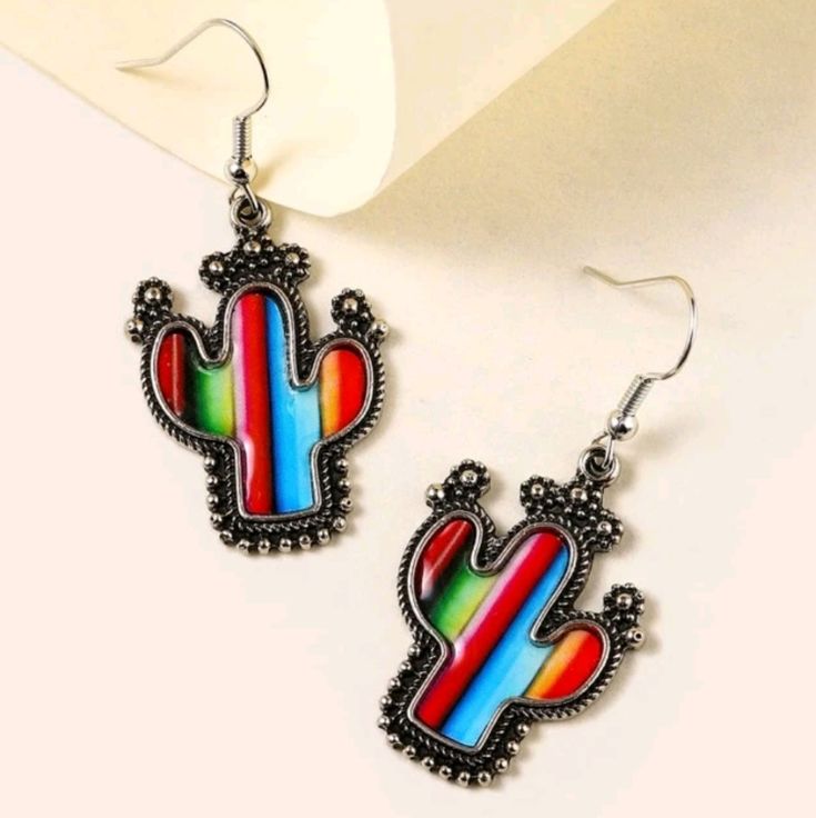 1 Pair Of Striped Multicolor Cactus Dangle Earrings Eardrop Length: 4.9 Cm Width: 2.3 Cm Tags: Bohemian, Boho, Hippie, Hippy, Beach, Retro Aztec, Vintage, 60s, 70s, Summer, Spring, Floral, Gypsy, Artistic, Art, Artsy, Fairycore, Fairy Core, Grunge, Festival, Desert, Mexican, Mexico, Desert, Deserts, Midwest Neon, Bright, Colorful, Multicolor, California, California, New Mexico, Tribal, Native American, Heritage, Symbol, Historic, Trending, Vertical Stripes, Western, West Coast, Westcoast, Colorf Summer Multicolor Nickel-free Earrings, Colorful Casual Jewelry For Festival, Trendy Multicolor Teardrop Jewelry, Casual Summer Dangle Jewelry, Multicolor Metal Earrings For Beach, Multicolor Metal Earrings For The Beach, Multicolor Teardrop Casual Jewelry, Retro Multicolor Drop Earrings, Casual Multicolor Teardrop Jewelry