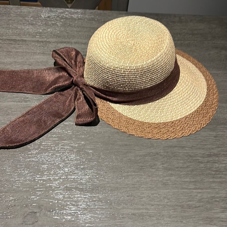 Cute Straw Hat With Dark Brown Bow Detail. Never Worn Vintage Brown Sun Hat For Vacation, Brown Wide Brim Cloche Hat For Spring, Casual Brown Adjustable Mini Hat, Adjustable Brown Visor Bucket Hat, Chic Adjustable Brown Cloche Hat, Brown Straw Hat For Spring, One Size Fits Most, Brown Straw Hat One Size For Spring, Brown Brimmed Mini Hats For The Beach, Brown Brimmed Mini Hat For Beach