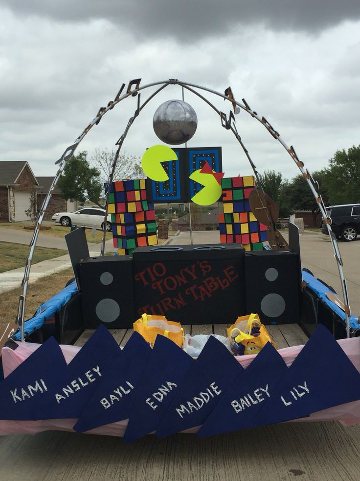 the back end of a truck decorated with paper mache and other things that are attached to it