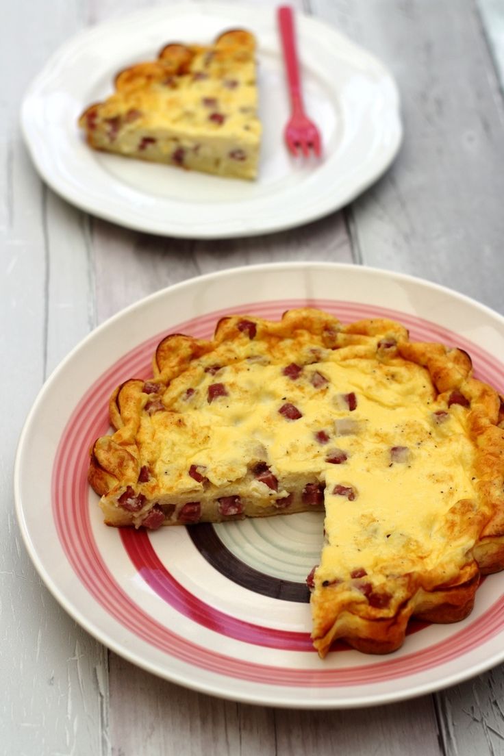 two plates with pies on them and one has a slice taken out of it