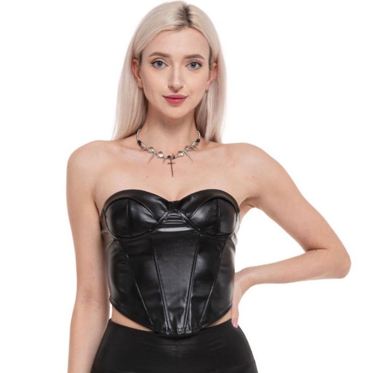 Start your DIY costume with this flattering black corset! The figure-hugging accessory has front pleats for a tapered waistline in an edgy faux leather fabric. The sky's the limit in this versatile top. pbBlack Faux Leather Corset product details:-b-p ul liFaux leather plastic and metal-li liBack zipper-li liDoes not include necklace pants or shoes-li liReview the size chart for sizing information-li -ul Chic Fitted Corset, Edgy Corset With Corset Back For Costume Party, Faux Leather Corset With Corset Back, Fitted Faux Leather Corset For Club, Faux Leather Fitted Corset For Club, Black Leather Corset For Club Wear, Black Edgy Overbust Corset, Edgy Black Overbust Corset, Gothic Strapless Corset For Club