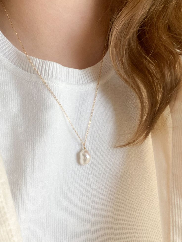 This necklace is 20 inches long. The perfect minimal necklace to wear with any outfit. The Pearl is unique and is cultured. The chain and other components are gold filled, a thick layer of gold over the base metal. This piece is safe to wear in water, but should stay away from any chemicals. Minimalist White Chain Necklace For Everyday, Simple Everyday Jewelry With Pearl Charm, Minimalist Everyday Single Strand Chain Necklace, White Minimalist Necklace With Delicate Chain, Minimalist Round Pendant Pearl Necklace, Everyday Adjustable Necklace With Pearl Charm, Adjustable Everyday Necklace With Pearl Charm, Minimalist White Single Strand Chain Necklace, White Minimalist Single Strand Chain Necklace