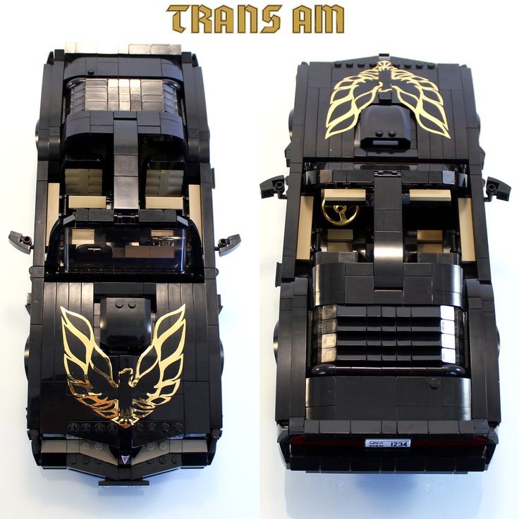 two lego cars that are made to look like they have gold and black designs on them