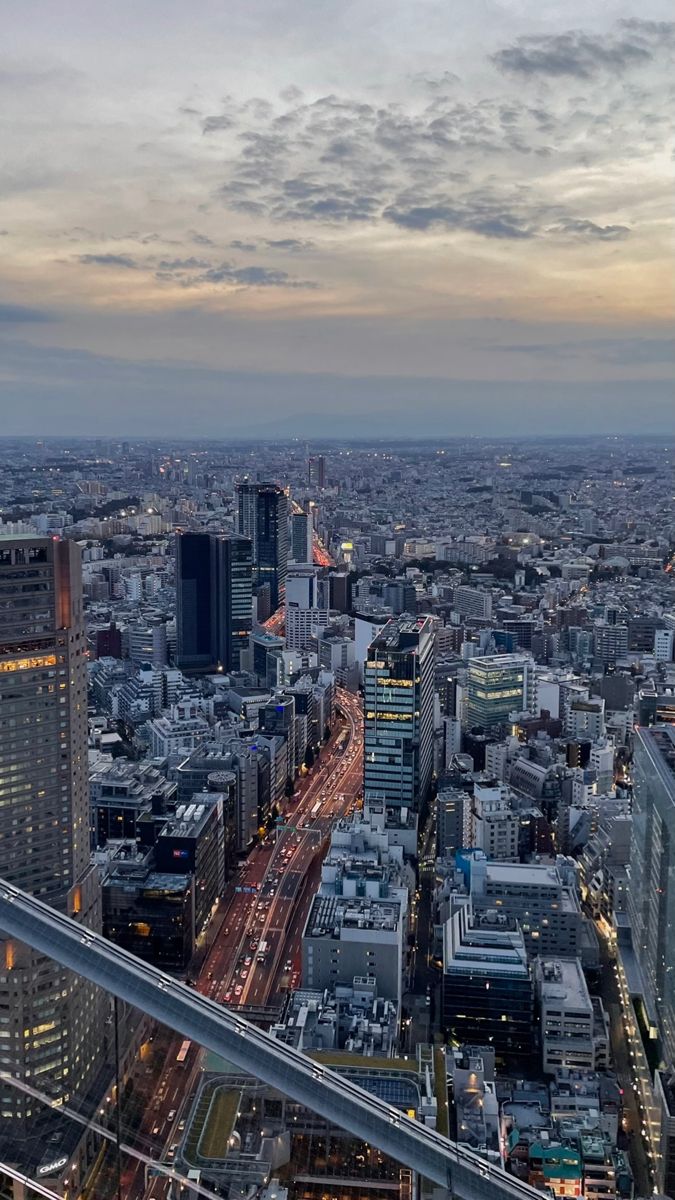 an aerial view of a city at dusk