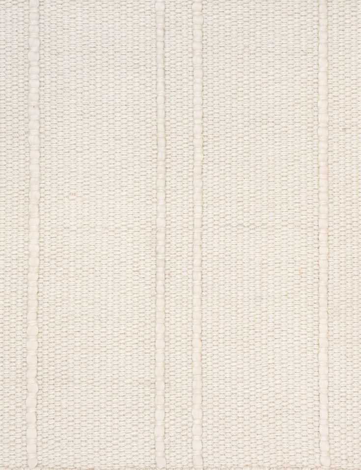 a white rug with vertical stripes on the top and bottom, as well as an off - white background