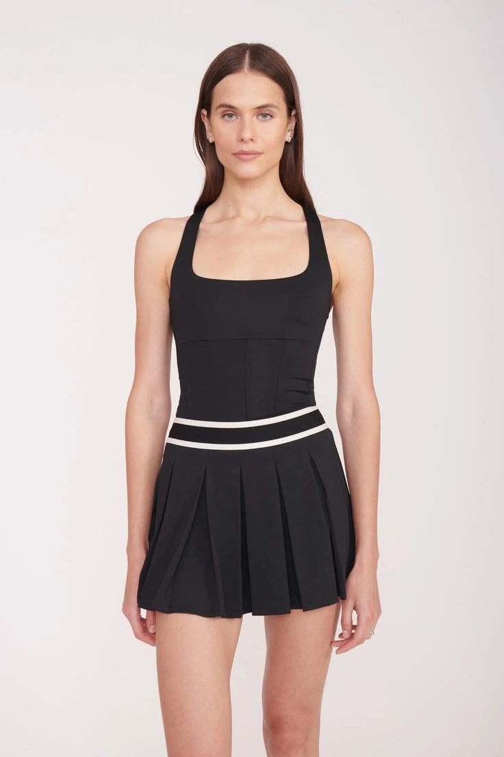 A scoop neck tank top with corset seaming, the Carry Top features moisture-wicking fabric technology to help you stay dry and comfortable on and off the court. Black Tennis Dress With Built-in Bra, Fitted Nylon Tank Top For Athleisure, Fitted Sleeveless Tennis Tops, Fitted Go-dry Scoop Neck Tank Top, Fitted Scoop Neck Tank Top With Go-dry Technology, Fitted Scoop Neck Go-dry Tank Top, Black Sleeveless Tennis Dress With Built-in Bra, Fitted Black Tennis Dress With Built-in Bra, Fitted Nylon Racerback Tank Top