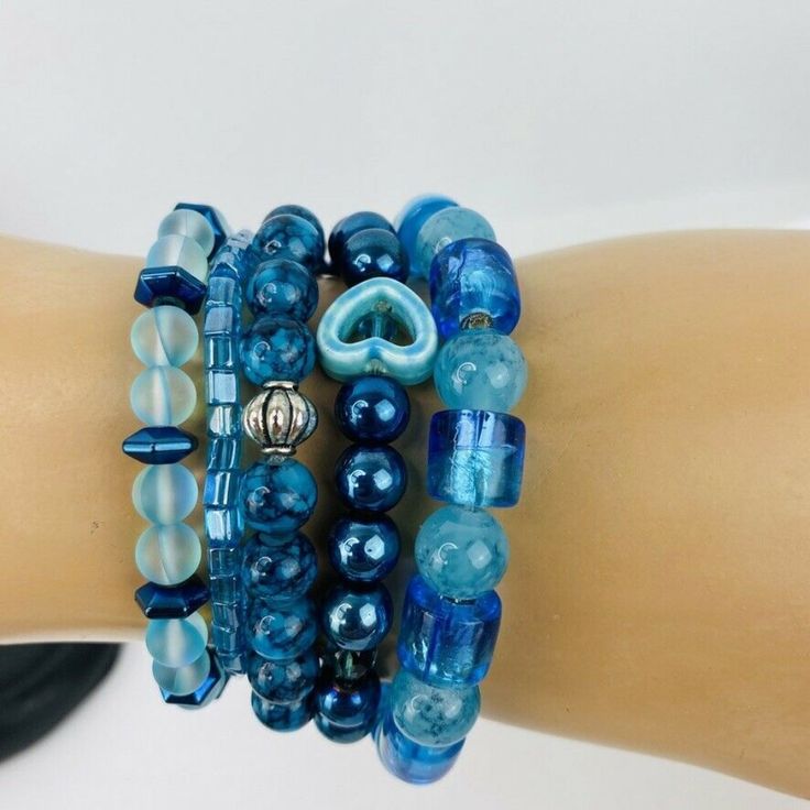 Blue Silver Tone Crystal Frost Floral Stack Bracelets Mermaid Beads Handmade Stretch Bracelet Adjustable Size Fits Anyone Large Or Small Blue Bohemian Stretch Bracelet With Colorful Beads, Bohemian Blue Stretch Bracelet With Colorful Beads, Blue Bohemian Bracelets With Spacer Beads, Bohemian Blue Bracelets With Spacer Beads, Blue Bohemian Beaded Bracelets With Faceted Beads, Bohemian Blue Beaded Bracelets With Faceted Beads, Handmade Blue Bohemian Stretch Bracelet, Blue Bohemian Handmade Stretch Bracelet, Adjustable Blue Stretch Bracelet With Heart Beads