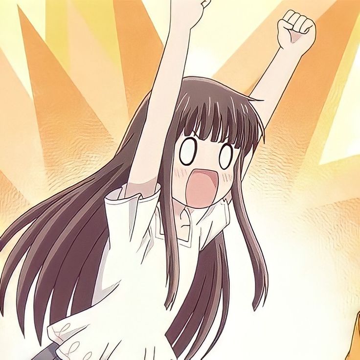 a girl raising her arms in the air