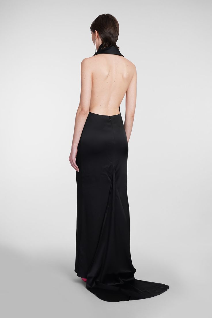 the back of a woman wearing a black gown