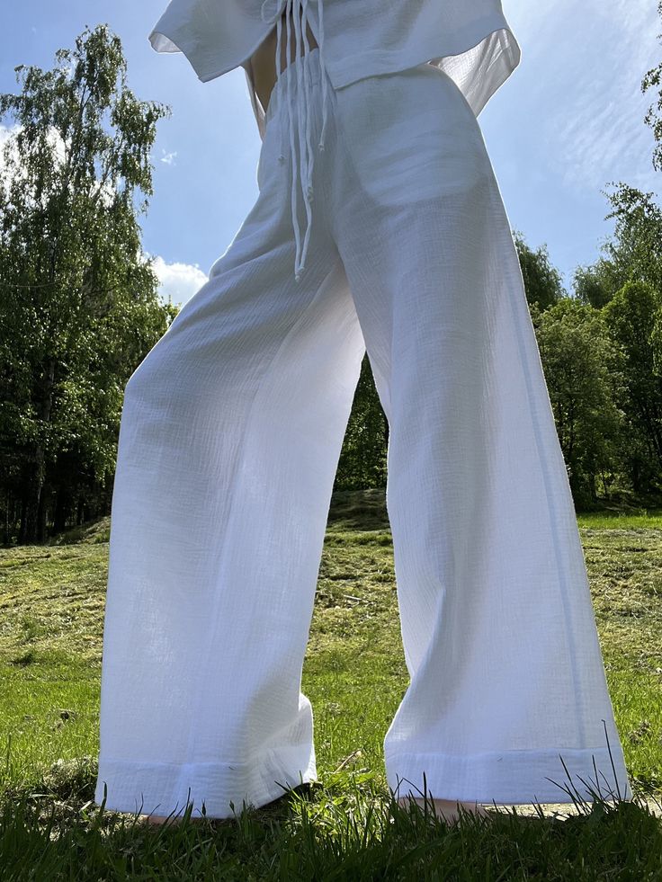 Presenting fantastic loose fitting elasticated pants that are made of ecologically grown cotton muslin. They are great for a casual style as well as the elegant evening.  Very classic and elegant summer pants. It has got 2 pockets on the sides. It is the ultimate fabric for hot weather as it breathes and absorbs moisture better that most fabrics. Extremely soft touch. Please write me a note if you would like any other colour from our fabric options, using a number or a name of a colour of your c Solid Color Wide-leg Parachute Pants For Summer, Solid Wide-leg Parachute Pants For Summer, Solid Color Summer Wide-leg Parachute Pants, Relaxed Fit Ankle-length Parachute Pants For Summer, Summer Wide Leg Solid Parachute Pants, Summer Cotton Wide Leg Parachute Pants, Straight Parachute Pants For Summer Loungewear, Summer Cotton Straight Leg Wide Pants, Relaxed Wide-leg Harem Pants For Summer