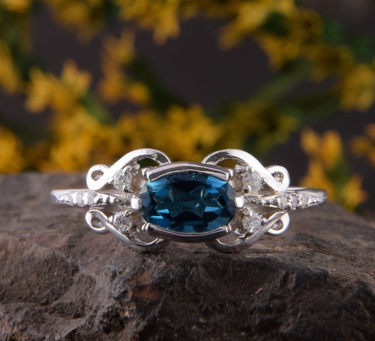 "Unique sterling silver blue topaz art deco cocktail ring, Antique womens silver ring, Victorian engagement silver ring, Womens topaz ring WE OFFER UNLIMITED PERIOD INSTALLMENTS PLAN This is a beautiful, stunning, feminine ring that works well for all occasions, styles, and ages. You will love it! Ring information Main stone: London blue topaz Approximate size: 7x5mm Accent stones: White cubic zirconia Approximate size: 1.5mm (4 stones) Approximate size: 1.0mm (6 stones) Metal type: Silver Metal Exquisite Topaz Ring With Diamond Accents, Elegant Formal Rings With Blue Topaz, Elegant Formal Blue Topaz Rings, Exquisite Topaz Gemstone Ring For Anniversary, Exquisite Gemstone Topaz Ring For Anniversary, Art Deco Blue Topaz Ring With Center Stone, Exquisite Blue Topaz Ring For Anniversary, Elegant Oval Topaz Ring With Diamond Accents, Elegant Blue Topaz Rings For Anniversary