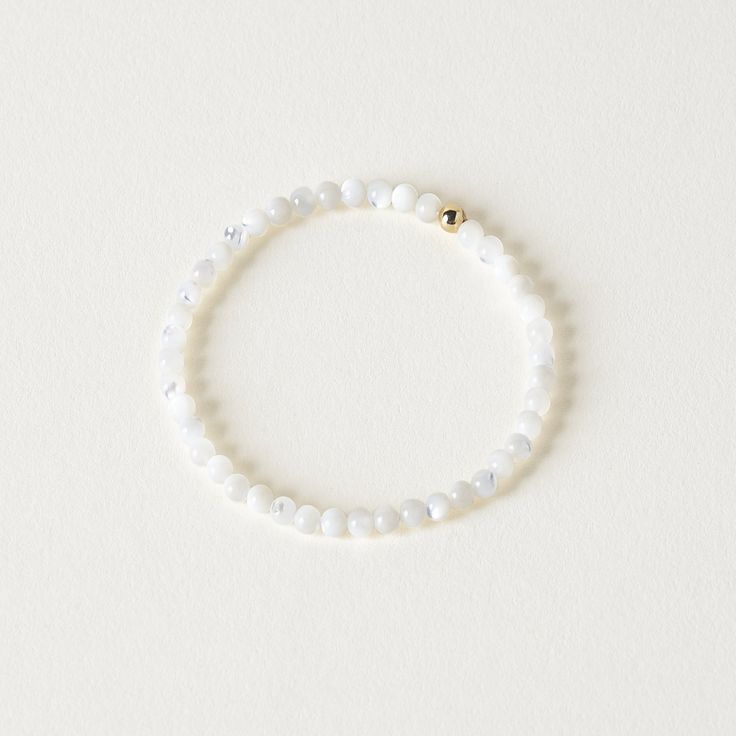 Elevate your everyday look with the Carter Gemstone Bracelet. Made with genuine mother of pearl, this bracelet adds a subtle touch of color to your stack. Perfect for pairing with other dainty bracelets or wearing on its own for a chic statement. *Natural color and size may vary. Dimensions:6 1/4" interior diameter; Genuine mother of pearl measures 3/16" Dainty Hypoallergenic White Bracelets, Dainty White Hypoallergenic Bracelets, Dainty White Hypoallergenic Bracelet, White Classic Beaded Bracelets For Everyday, Elegant Adjustable Mother Of Pearl Beaded Bracelets, Delicate White Adjustable Crystal Bracelet, Classic White Bracelets For Everyday, Delicate Faceted Beaded Bracelets For Everyday, Everyday Moonstone Bracelets With Gemstone Beads