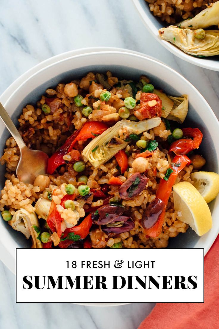 two bowls filled with rice and vegetables on top of a marble countertop next to a red napkin