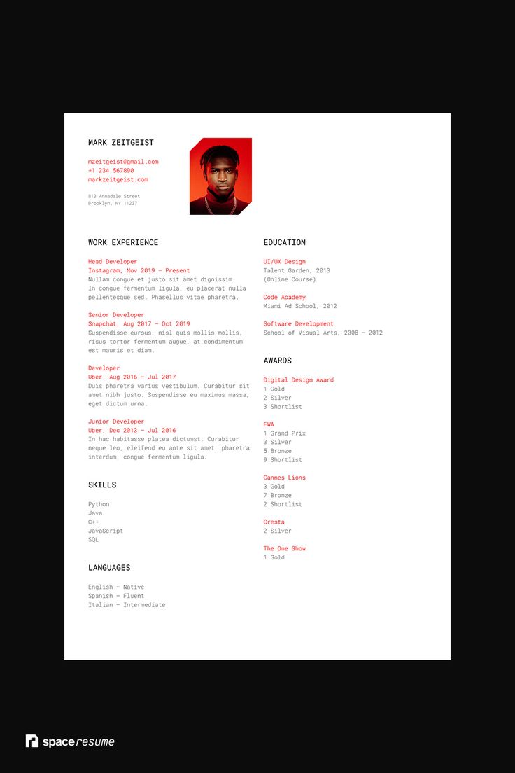 a black and white resume with red accents on the front, and an image of a man's face