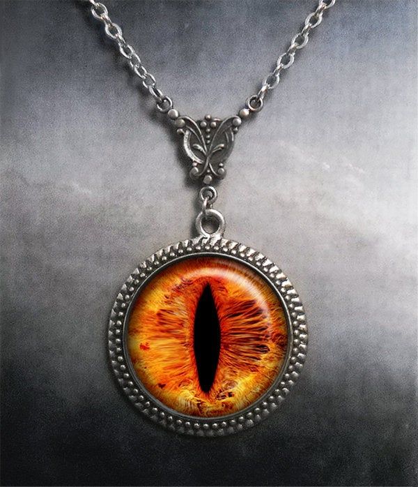 an orange cat's eye is shown in this necklace