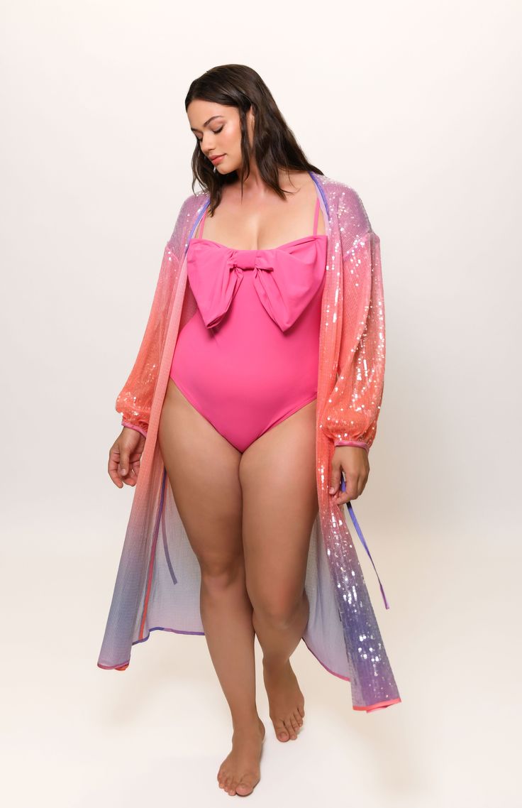 Maxi length cover-up Can be worn as a swim coverup or layering piece Long sleeve Sheer fabric Tie at waist for closure Fabric: Sequin Mesh HPS: 51" Dry clean only Beachwear Wrap Cover-up For Loungewear, Beachwear Wrap Cover-up With Tie Waist, Long Beachwear Cover-up For Loungewear, Spring Party Beachwear Cover-up, Chic Long Sleeve Poolside Cover-up, Chic Long Sleeve Loungewear Cover-up, Long Sleeve Beachwear Cover-up, Long Sleeve Beachwear Cover-up For Pool, Long Sleeve Pool Cover-up For Beachwear